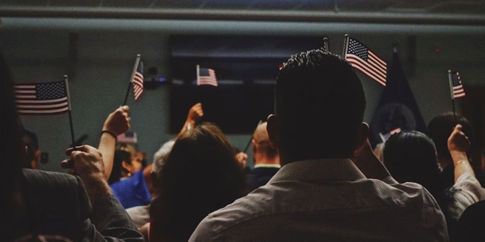people holding American flags