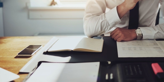 business man reviewing paperwork
